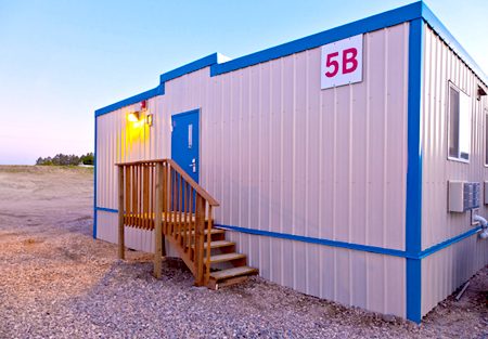 Single dorm unit exterior with wood entry stairs