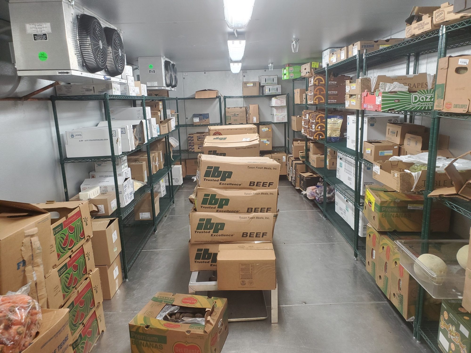 Dry storage room, stocked shelving
